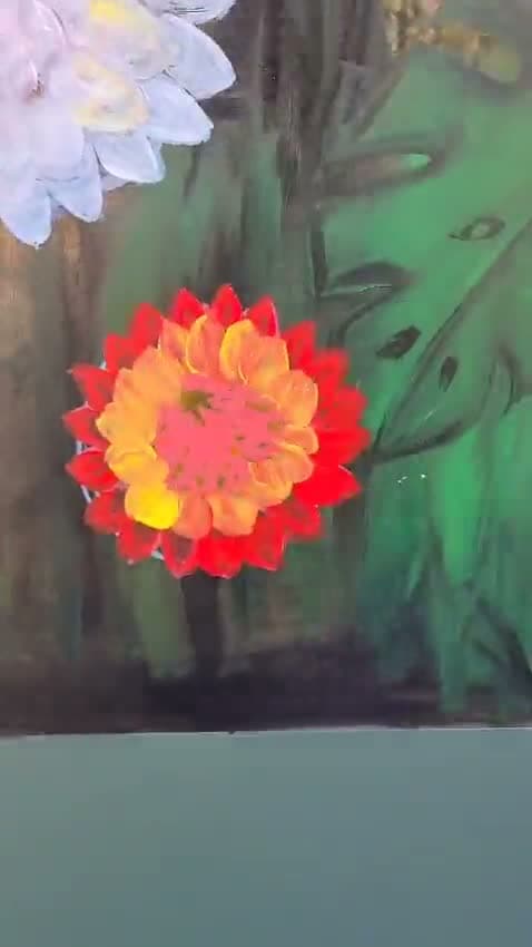 A dahlia painted on glass, finished — scarlet petals ringed around an orange and yellow centre.